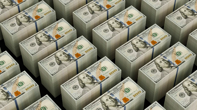 Stacks of hundred dollar bills are shown